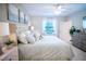 Serene main bedroom featuring soft lighting, neutral tones, and stylish decor at 5048 Silver Bell Dr, Port Charlotte, FL 33948