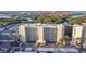 Elevated view showcasing condo building, parking, and waterfront location at 1000 Cove Cay Dr # 5E, Clearwater, FL 33760