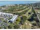 Aerial view of the community showcasing the lush golf course, surrounding buildings and waterfront access at 1000 Cove Cay Dr # 5E, Clearwater, FL 33760