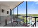 A comfortable seating area on this balcony offers scenic outdoor relaxation and views at 1000 Cove Cay Dr # 5E, Clearwater, FL 33760