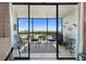 This balcony features a table and chairs, with a view of the surrounding area at 1000 Cove Cay Dr # 5E, Clearwater, FL 33760