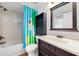 Bathroom featuring cabinet, tiled walls and shower at 1000 Cove Cay Dr # 5E, Clearwater, FL 33760