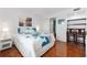 Bedroom with wood floors and large windows and desk area at 1000 Cove Cay Dr # 5E, Clearwater, FL 33760
