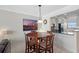 This cozy dining area is adjacent to the kitchen, creating a seamless flow for entertaining at 1000 Cove Cay Dr # 5E, Clearwater, FL 33760