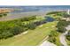 Scenic aerial view of the golf course with water features and lush landscaping, a picturesque setting for golf enthusiasts at 1000 Cove Cay Dr # 5E, Clearwater, FL 33760
