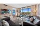 Comfortable living room offering a view of the balcony and bedroom at 1000 Cove Cay Dr # 5E, Clearwater, FL 33760