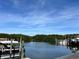 Picturesque waterfront view from the dock, featuring boats, calm waters, and lush mangrove shoreline at 1000 Cove Cay Dr # 5E, Clearwater, FL 33760