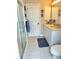 Bright bathroom features a vanity with a single sink and a glass-enclosed shower at 1727 Waxwing Cir, Venice, FL 34293