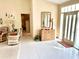 Bright and inviting foyer with neutral colors, a stylish dresser, and tiled floors at 1727 Waxwing Cir, Venice, FL 34293