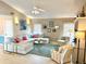 Stylish living room featuring a large sectional sofa and modern decor at 1727 Waxwing Cir, Venice, FL 34293