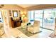 Living room featuring view to pool, two reclining chairs and bar area at 1727 Waxwing Cir, Venice, FL 34293