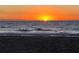 Scenic ocean view capturing the sun setting on the horizon, painting the sky with vibrant colors at 1727 Waxwing Cir, Venice, FL 34293