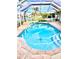 Sparkling pool with a screened enclosure and a view of the lake at 1727 Waxwing Cir, Venice, FL 34293