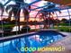 Evening view of a screened-in pool with a tranquil lake view, creating a serene ambiance at 1727 Waxwing Cir, Venice, FL 34293