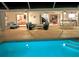 Screened-in patio with pool, seamlessly connecting multiple interior living spaces for relaxed indoor-outdoor living at 1727 Waxwing Cir, Venice, FL 34293