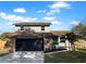 Beautiful two-story home with a two-car garage, stone accents, and a well-manicured lawn at 3305 Acapulco Dr, Riverview, FL 33578
