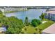 Overhead view of lakefront apartments surrounded by lush trees and green spaces at 3672 Lake Bayshore Dr # K327, Bradenton, FL 34205