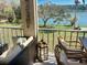Relaxing balcony with comfortable seating and serene views of the beautiful lake and surrounding greenery at 3672 Lake Bayshore Dr # K327, Bradenton, FL 34205