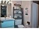Stylish bathroom with a modern vanity, shelving unit with beach-themed decor at 3672 Lake Bayshore Dr # K327, Bradenton, FL 34205
