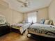 Comfortable bedroom with twin beds, beachy decor, and a calming atmosphere at 3672 Lake Bayshore Dr # K327, Bradenton, FL 34205