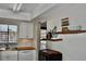 Functional kitchen area featuring stainless steel sink, wooden countertops, and coastal-themed decor at 3672 Lake Bayshore Dr # K327, Bradenton, FL 34205