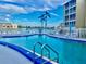 Enjoy this community pool with lovely chaise lounges and nearby palms, perfect for relaxation at 3672 Lake Bayshore Dr # K327, Bradenton, FL 34205