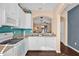 Kitchen featuring white cabinets and stainless steel appliances at 7024 Timberside Pl, Riverview, FL 33578