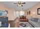 Spacious living room with hardwood floors, a cozy seating area, and an adjacent dining area for entertaining at 7024 Timberside Pl, Riverview, FL 33578