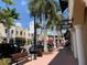 Charming downtown street with shops, palm trees, and pedestrian walkways at 3672 Lake Bayshore Dr # K327, Bradenton, FL 34205