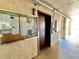 Hallway view of the condo elevator and community notice board at 3672 Lake Bayshore Dr # K327, Bradenton, FL 34205
