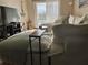Cozy living room featuring a comfortable sectional, stylish decor, and a view from the balcony at 3672 Lake Bayshore Dr # K327, Bradenton, FL 34205
