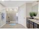 Modern bathroom with a glass enclosed shower, granite counters and dark wood cabinets at 4010 Lindever Ln, Palmetto, FL 34221