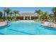 A community pool with a covered lounging area at 4010 Lindever Ln, Palmetto, FL 34221