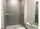 Modern bathroom with neutral tile, standing shower, and gray countertop and sink at 25164 Calusa Dr, Punta Gorda, FL 33955