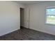 Bright bedroom features tile floors and an open door leading to a closet or ensuite bathroom at 25164 Calusa Dr, Punta Gorda, FL 33955