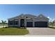 Beautiful single Gathering home with stone accents, a two-car garage and new landscaping at 25164 Calusa Dr, Punta Gorda, FL 33955