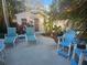 Charming backyard shed with patio furniture and colorful, tropical landscaping at 424 N Carolina Ave, Palm Harbor, FL 34683