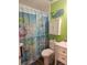 Bathroom with a vibrant sea-themed decor including a blue whale decoration at 424 N Carolina Ave, Palm Harbor, FL 34683