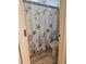 Bathroom with tiled floor featuring a starfish-themed shower curtain at 424 N Carolina Ave, Palm Harbor, FL 34683