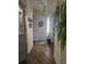 Welcoming foyer featuring wood look flooring and a decorative wreath on the front door at 424 N Carolina Ave, Palm Harbor, FL 34683