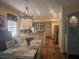 Open-concept kitchen and dining area with updated appliances and an abundance of natural light at 424 N Carolina Ave, Palm Harbor, FL 34683