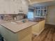 Modern kitchen featuring white cabinetry, granite countertops, and stainless steel appliances at 424 N Carolina Ave, Palm Harbor, FL 34683