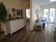 Comfortable living area with stylish decor, wood flooring, and access to a sunny patio at 424 N Carolina Ave, Palm Harbor, FL 34683