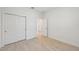 An empty bedroom featuring wood-look flooring and sliding closet doors at 467 Sun Chaser Dr, Nokomis, FL 34275
