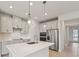 Bright kitchen with stainless appliances, subway tile backsplash, and center island at 467 Sun Chaser Dr, Nokomis, FL 34275