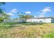 Large grassy backyard featuring a shed, ideal for Gathering activities and outdoor enjoyment at 1616 39Th Avenue E Dr, Ellenton, FL 34222