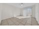 Bright bedroom with tile floors and a sliding door at 1616 39Th Avenue E Dr, Ellenton, FL 34222