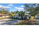 Charming single-story home featuring a well-maintained lawn, complemented by mature trees at 1616 39Th Avenue E Dr, Ellenton, FL 34222