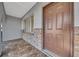 Close-up of the front door, showcasing the brickwork and neutral color scheme at 1616 39Th Avenue E Dr, Ellenton, FL 34222