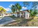 Charming home featuring stucco walls, arched entry, and a well-maintained front yard at 1616 39Th Avenue E Dr, Ellenton, FL 34222